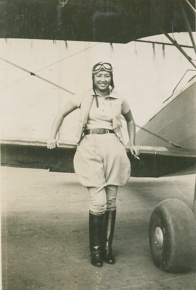 Hazel Ying Lee standing in front of a plane in 1932. US Air Force photo/Maj. Alysia R. Harvey.
