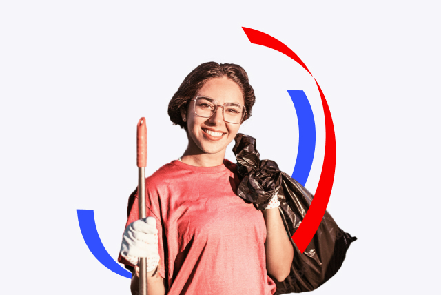 Volunteer holding a waste bag and cleaning tool