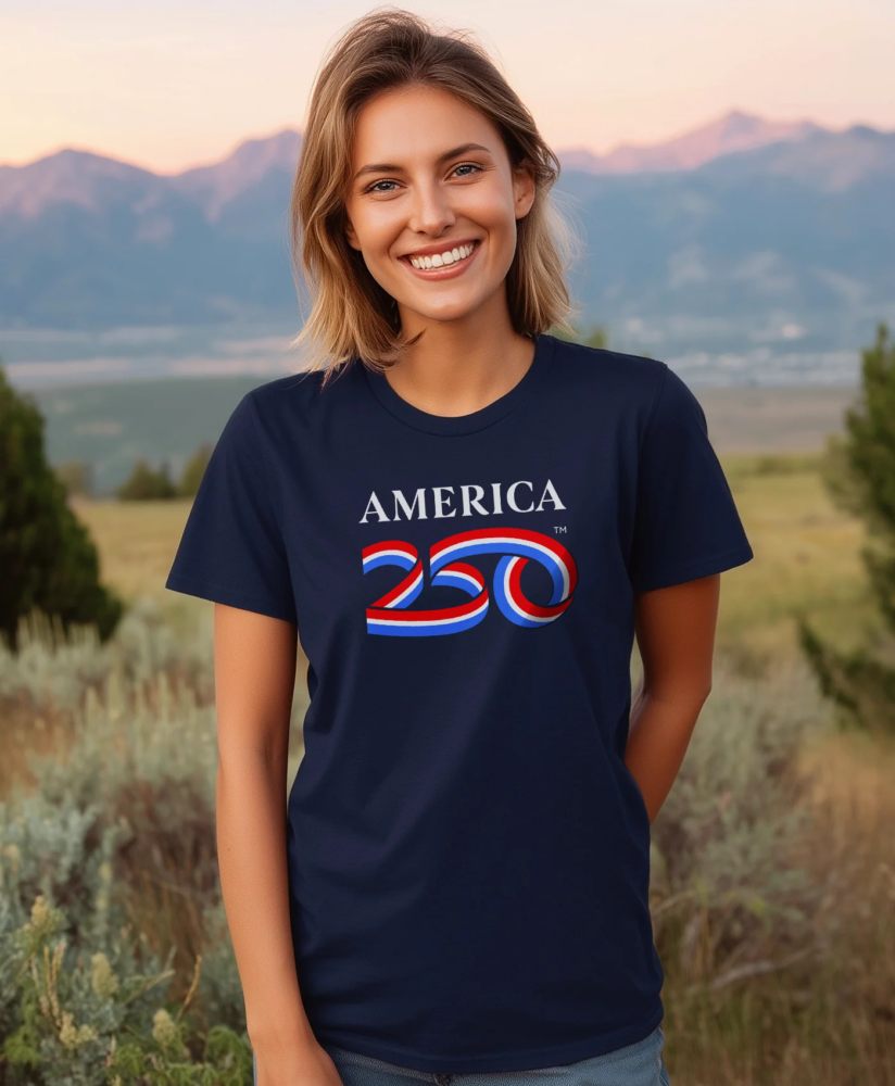 Woman standing in field with America250 shirt
