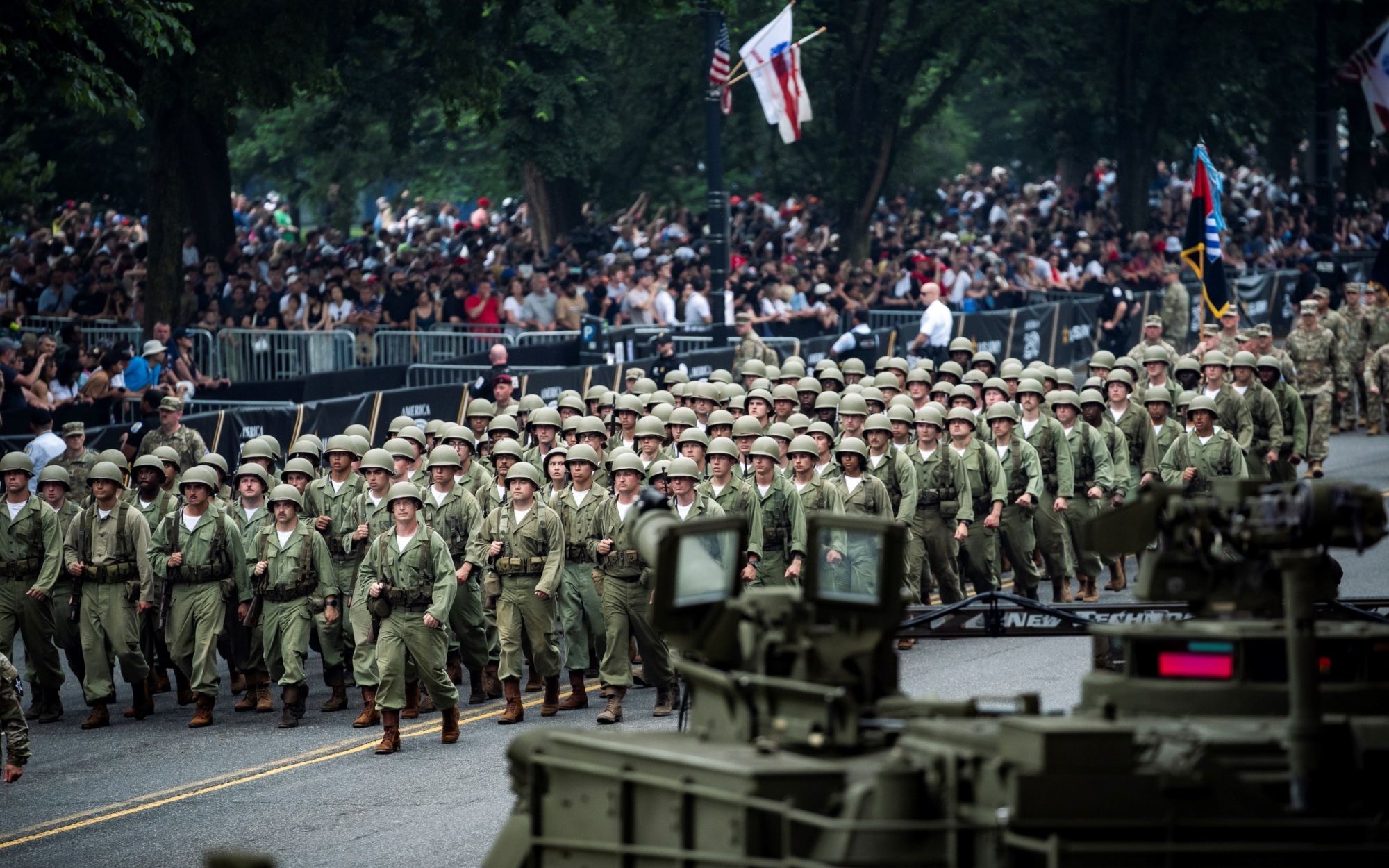Soldiers on parade, dressed in World War II-era uniforms