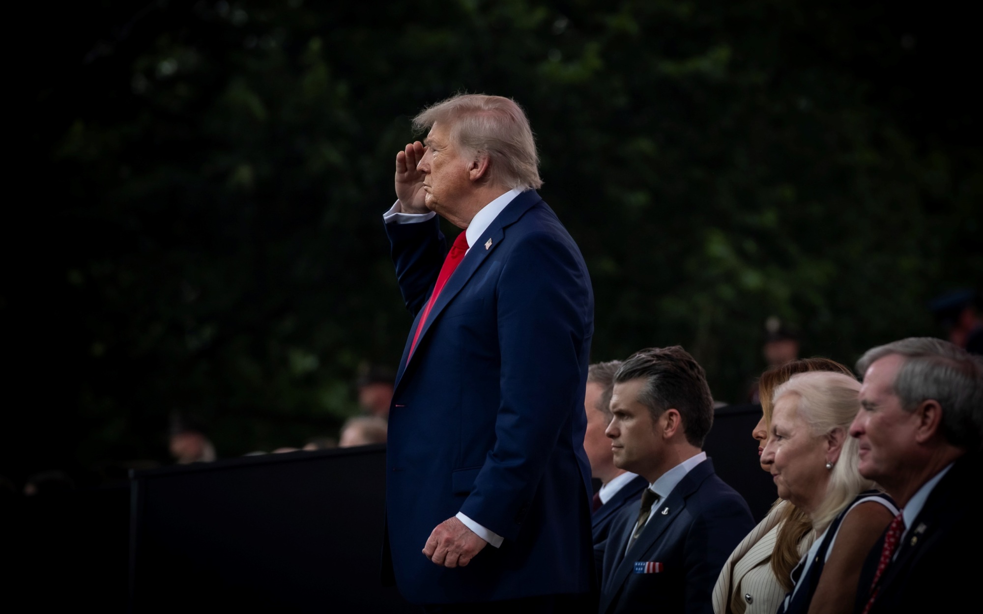 President Donald J. Trump saluting soldiers on parade