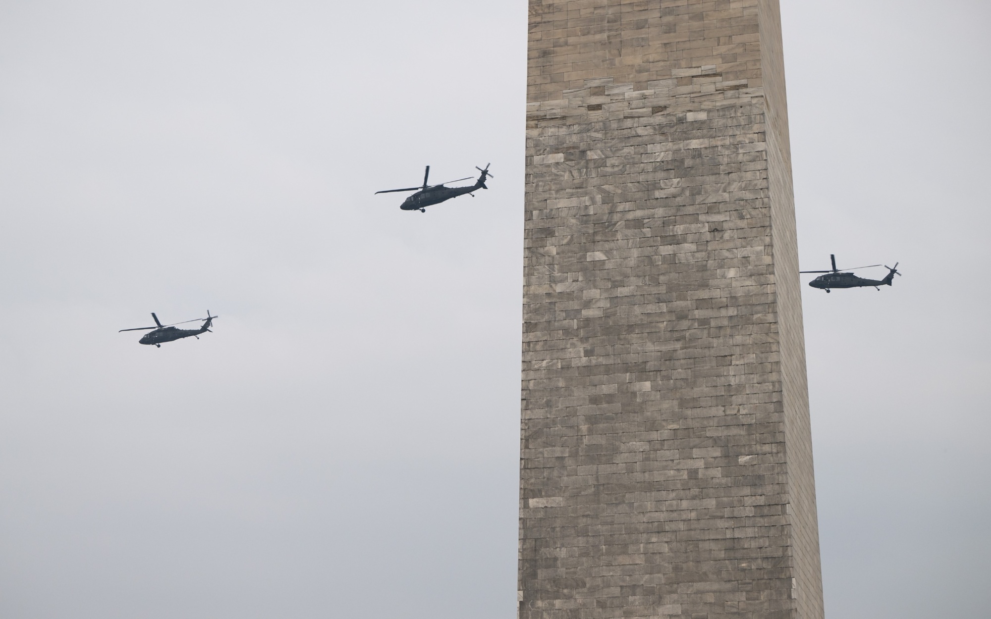 U.S Army helicopters flying by the Washington Monument