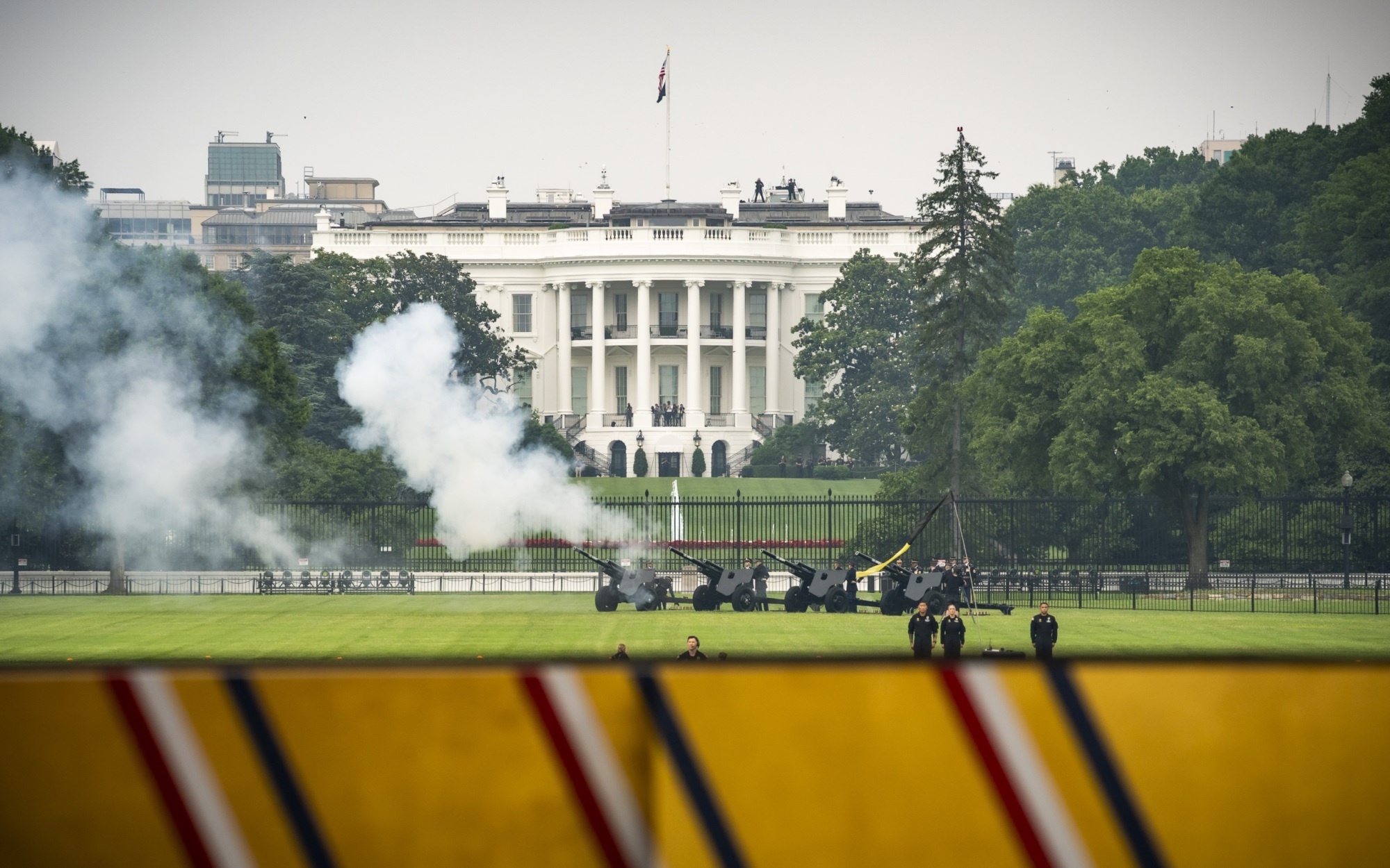 Cannon salute to the President of the United States, with the White House in the background