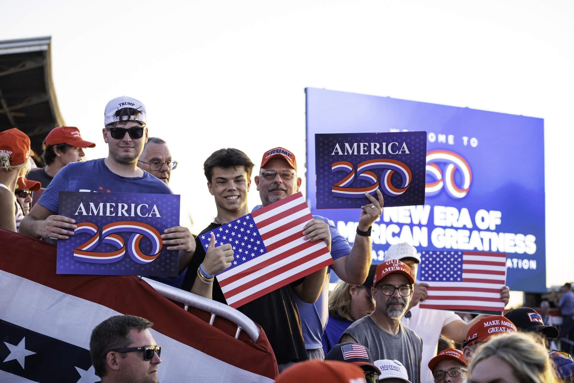 Patriotic crowd with American flags at America250 Iowa event on July 3 2025